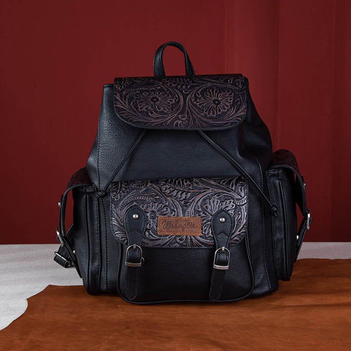 Sac à dos vintage avec motif floral gravé.